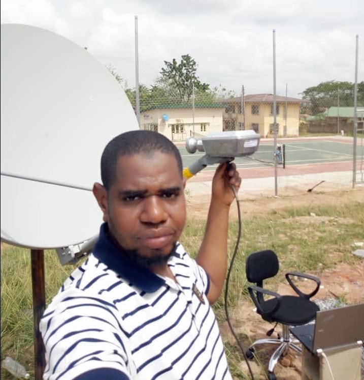 Smartsoft Technologies engineer installing a satellite internet dish on site