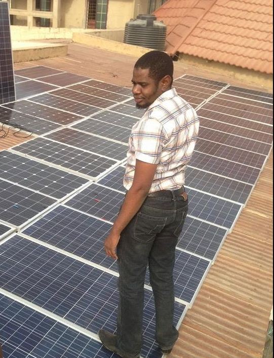 Smartsoft Technologies engineer inspecting a rooftop solar power installation